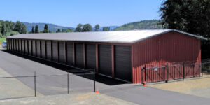 a building with doors and a fence